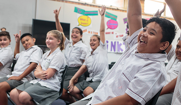 Classroom of excited and engaged students participating in an activity.