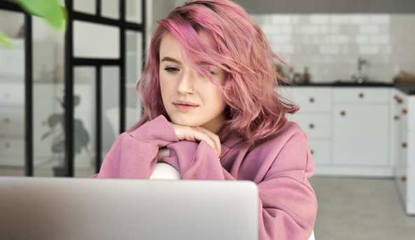 Young woman concentrating on her laptop