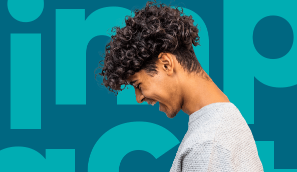 Young man laughing happily with “impact report” wording in the background.